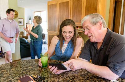 Photo of Nancy Moen and Chuck Velte visiting with MU School of Medicine students Parker Russell and Abigale Berry.