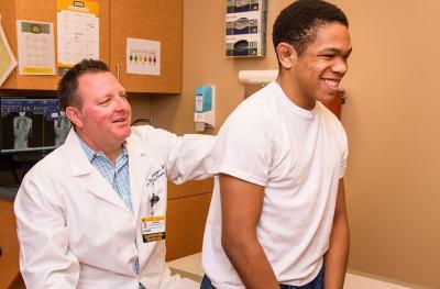 Dr. Hoernschemeyer, MD, examines Terrence Brown