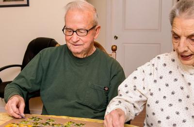 Ralph and Lola enjoying putting together jigsaw puzzles