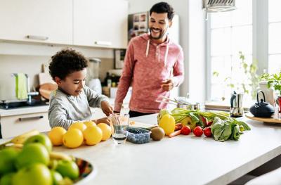 father and son cook healthy food