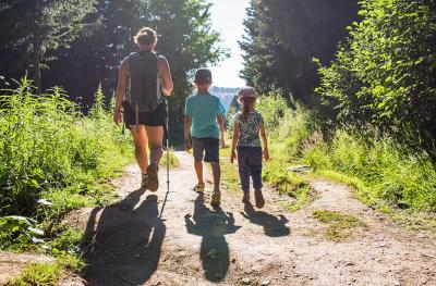 family hiking in the woods