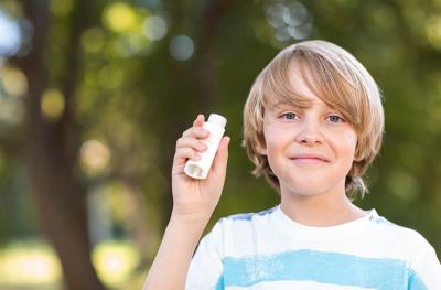 boy with asthma inhaler