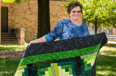 Brenda Duncan with quilt