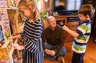 Paul Penn, thyroid cancer patient at Ellis Fischel, plays with his grandchildren.