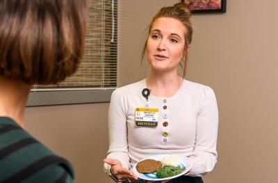Dietitian Michelle Bauche meeting with bariatric surgery patient