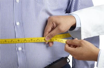 Photo of Doctor Taking Waist Measurement