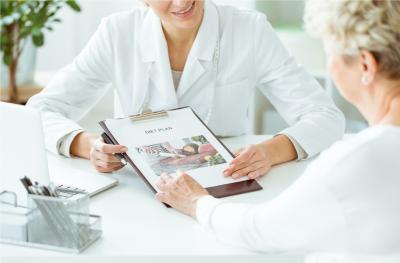 Photo of Dietician Consulting with Patient