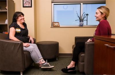 Provider speaking with adult patient