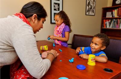 Photo of Provider working with two young children