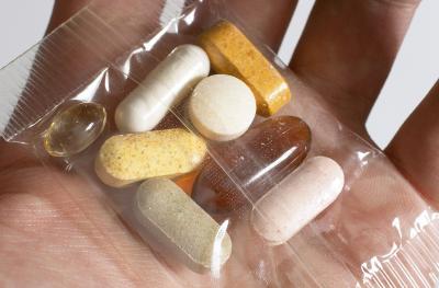 hand holding vitamins
