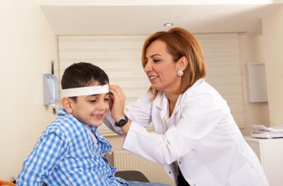 Young boy and doctor at pediatric neurosciences appointment
