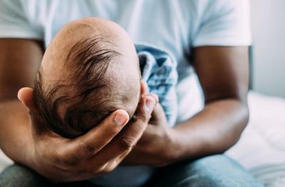 man holding an infant