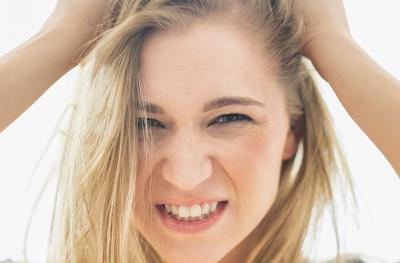 frustrated woman pulling out her hair