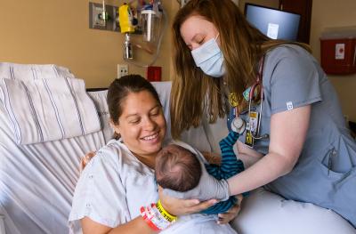 doctor with patient in hospital bed
