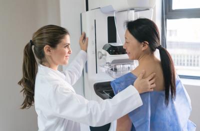 Doctor performing mammogram