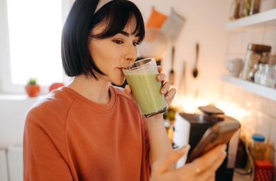 woman drinking a smoothy