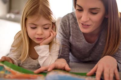 mother and child reading together