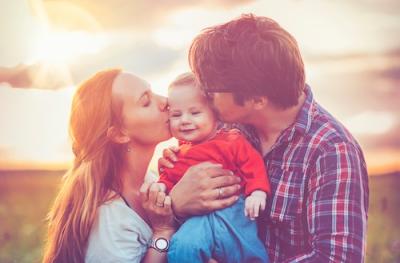 Parents holding child
