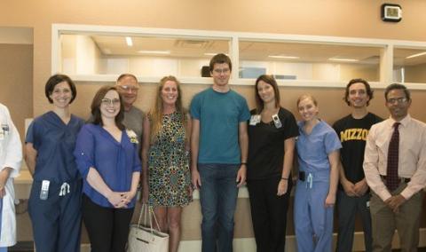 Casey O'Connor (center, t-shirt), his parents and care team.