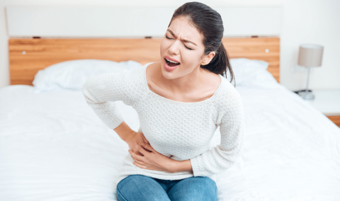 Woman with upset stomach