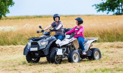 Couple riding ATV