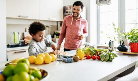 father and son cook healthy food