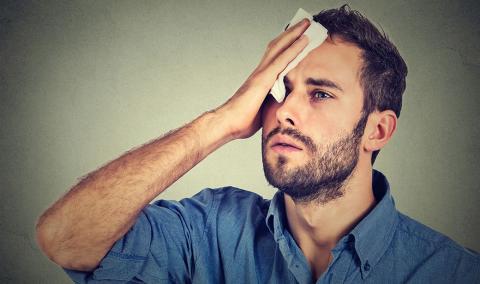 photo of man sweating