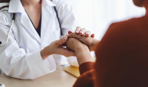 doctor consoles patient