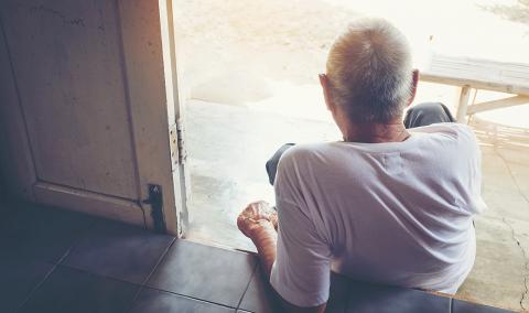 photo of man sitting alone