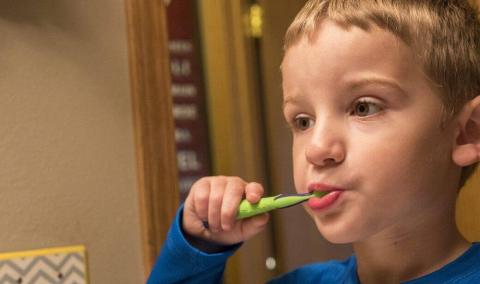 Child brushing teeth