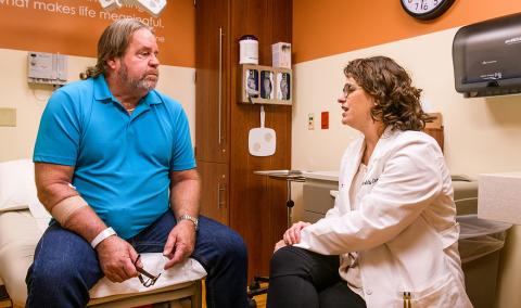 Mark Terry meets with MU Health Care urologist Katie Murray, DO