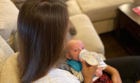 woman feeding baby