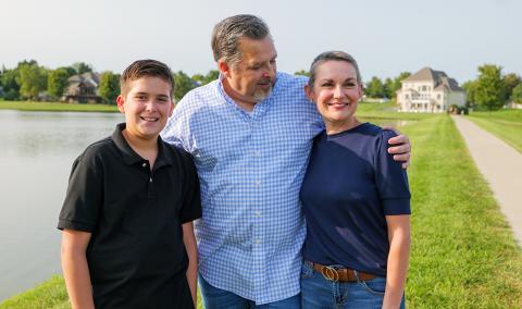 Christie McCullough walks with her family