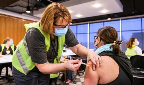 Person receiving the COVID-19 vaccination