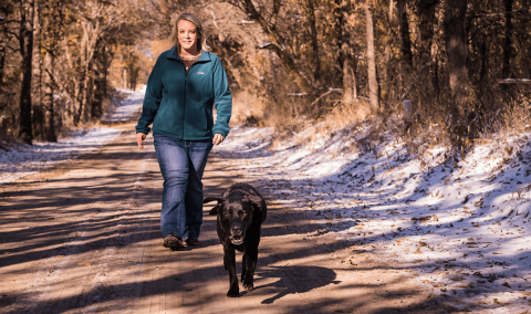 Megan Lawson walks with her dog after weight loss surgery