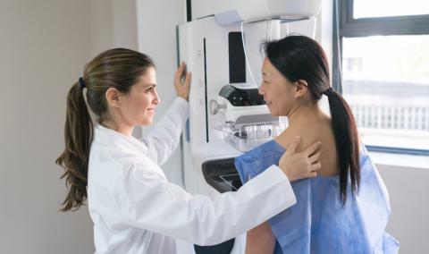 Doctor performing mammogram