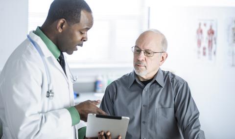 doctor talking with male patient