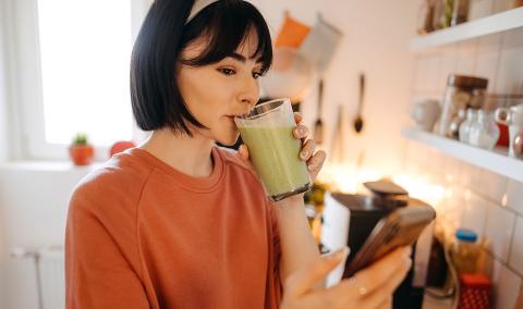 woman drinking a smoothy