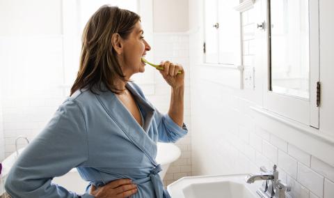 Woman brushing her teeth