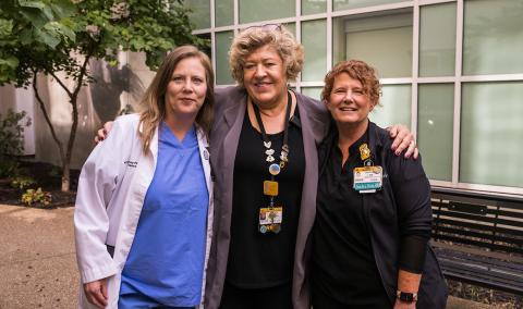 (From left) Kim Pfeiffer, Donna Pond, and Daphne Ingebritson stand in the Healing Garden.