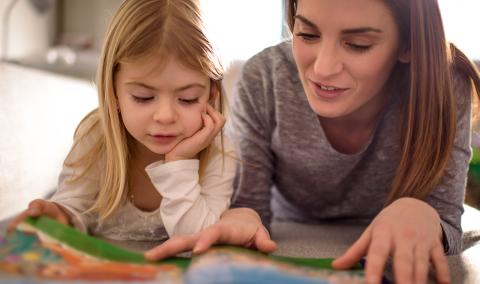 mother and child reading together