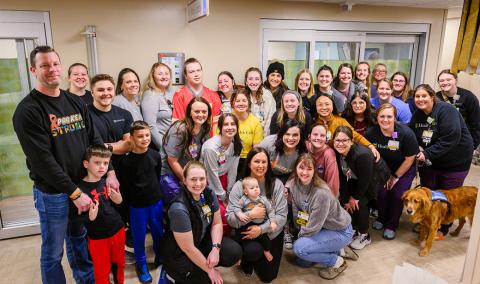 A group photo of people in a healthcare facility.