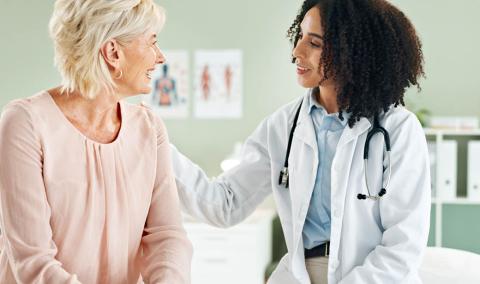 A physician speaks with a patient.