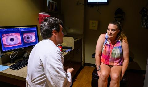 A photo of a woman speaking with a physician.