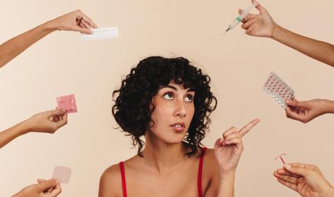 A woman is choosing from a variety of options.