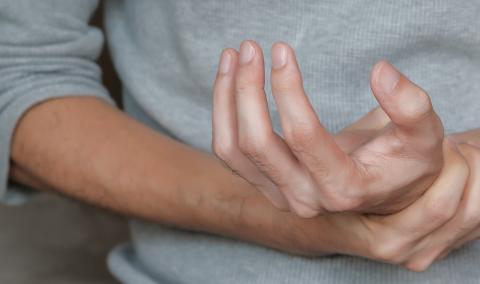A person dealing with achy hands