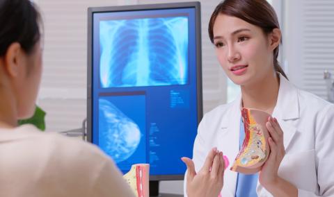 A physician speaking with a patient.
