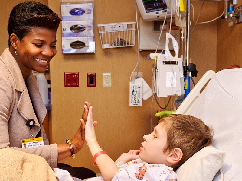 Dr. Buatsi with a patient