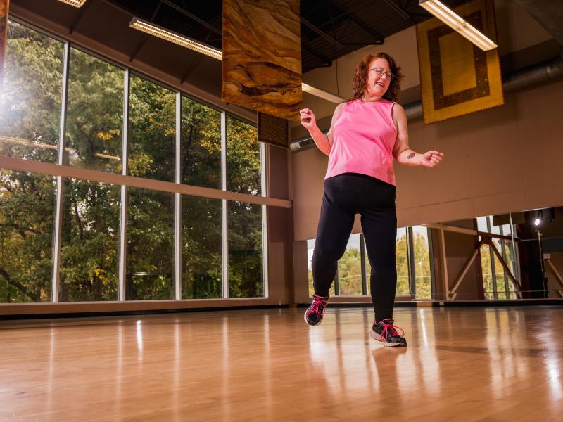 Woman dances in a fitness studio