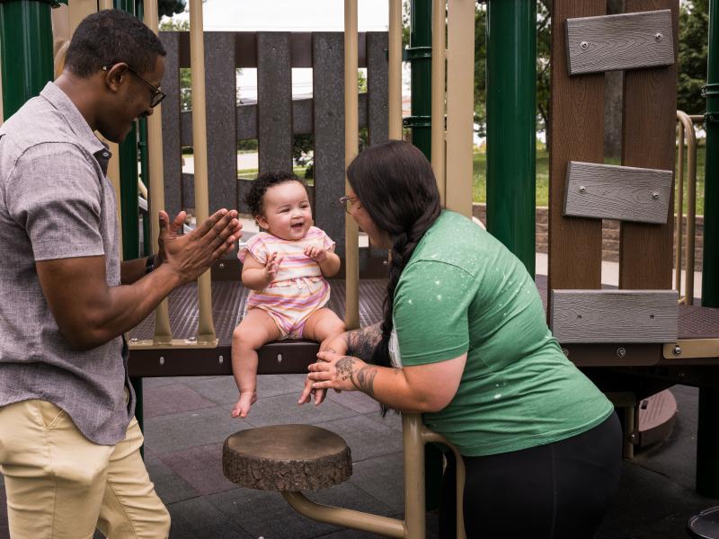 Shelton Brown (left) and Mylissa Brown play with their daughter, Nola, at Jefferson City Memorial Park on June 13, 2023.